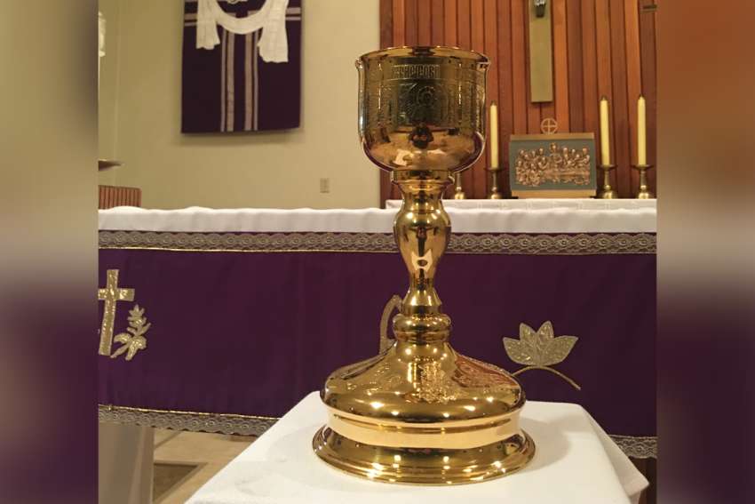 The chalice that was rescued from a local scrap yard and used in St Martin of Tours Church&#039;s &quot;Travelling Chalice&quot; program on display in the church. 