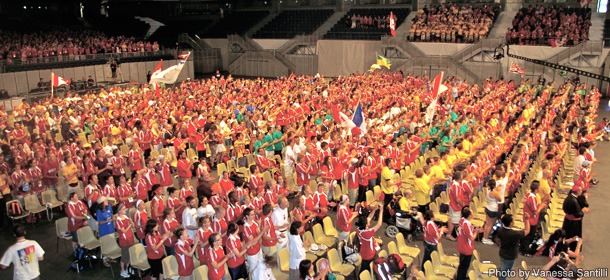 An energetic crowd of 5,000 Canadian pilgrims are brought to their feet inside the Palacio de Desportes in Madrid on August 16, the opening day of World Youth Day 2011.