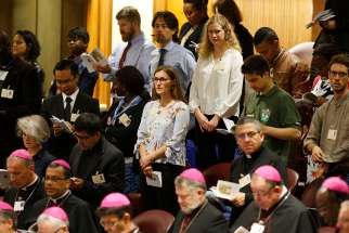  Bishops and observers attend a session of the Synod of Bishops on young people, the faith and vocational discernment at the Vatican Oct. 18. 