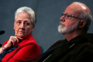 Irish abuse victim Marie Collins, the lone clerical abuse survivor nominated by Pope Francis to sit on the new Pontifical Commission for the Protection of Minors, looks at Boston Cardinal Sean P. O&#039;Malley during their first briefing at the Holy See press office at the Vatican May 3.
