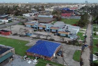  Buildings damaged by Hurricane Laura are seen in an Aug. 30, 2020, aerial photograph in Lake Charles, La.