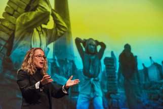  Photographer Lisa Kristine gives a presentation at St. Norbert College in De Pere, Wis., March 1, about her work photographing human trafficking around the world.