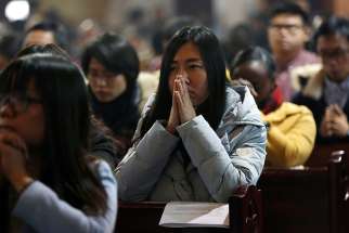  People pray during Mass in 2016 at the Cathedral of the Immaculate Conception in Beijing. A Chinese communist party official indicated July 19 that Beijing intends to retain tight grip on the Catholic Church.