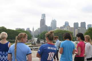 Women finish praying the rosary together at the top of the Philadelphia Museum of Art&#039;s iconic steps overlooking the Philadelphia skyline May 27. Pope Francis will have a similar view, including more than 1 million people, when he celebrates Mass in Philadelphia during his Sept. 22-27 visit to the United States. 