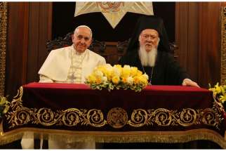Pope Francis and Ecumenical Patriarch Bartholomew of Constantinople sit during signing of joint declaration at the patriarchal Church of St. George in Istanbul Nov. 30.