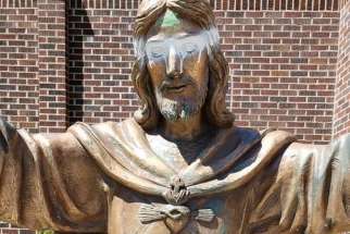Vandals defaced a statue of Jesus outside Calgary’s Sacred Heart Church in mid-July.