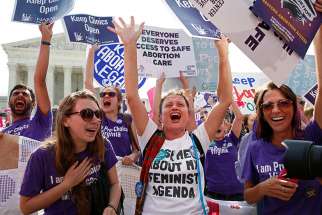 Demonstrators celebrate at the U.S. Supreme Court after the court struck down a Texas law imposing strict regulations on abortion doctors and facilities that its critics contended were specifically designed to shut down clinics in Washington on June 27, 2016.