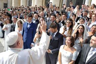 Pope Francis greets newly married couples during his general audience in St. Peter&#039;s Square at the Vatican Sept. 2015.