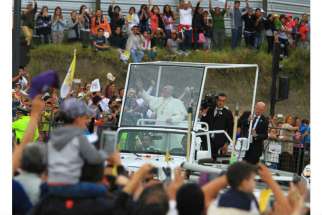Pope Francis greets the crowd from his popemobile, a Jeep Wrangler, as he arrives in Quito, Ecuador, July 5. The pontiff will use the same model during his visit to the United States in September. 