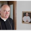 Bishop Bernard Fellay, superior of the Society of St. Pius X, is pictured near a photo of Pope Benedict XVI at the society&#039;s headquarters in Menzingen, Switzerland, May 11. Bishop Fellay acknowledged there could be a split in the breakaway society if it decides to reconcile with the Vatican.