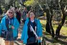 Andreia Lopo, right, with a colleague takes a group of pilgrims through Aljustre, home village of the three peasant children who witnessed the Marian apparitions at Fatima. As a tour guide, Lopo leads pilgrimages to many holy places, including Lourdes, France.