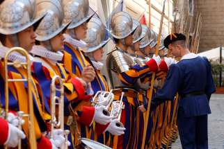 New recruits of the Pontifical Swiss Guard stand at attention while an officer inspects their uniforms during a training session at the Vatican April 30, 2024, ahead of their swearing-in ceremony May 6. 