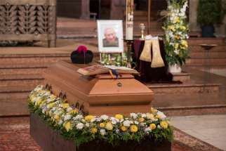 A photo is seen near the casket of Msgr. Georg Ratzinger, brother of retired Pope Benedict XVI, during his funeral Mass at the cathedral in Regensburg , Germany, July 8, 2020.