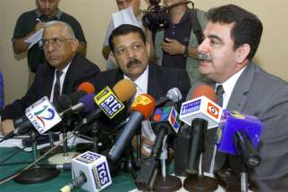 Salvadoran Gen. Rene Emilio Ponce, right, and his colleagues, Colonels Francisco Elena Fuentes, left, and Inocente Orlando Montano, center, are pictured in a 2000 photo during a news conference denying involvement in the 1989 deaths of six Jesuit priests, their housekeeper and her daughter.
