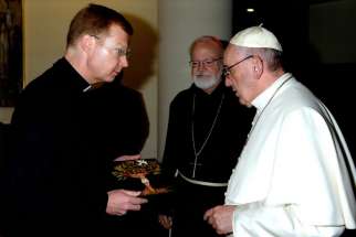 Fr. Hans Zollner presenting Windsor’s Deborah Kloos’s painting to Pope Francis.