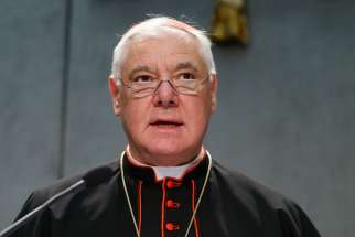 Cardinal Gerhard Muller, prefect of the Congregation for the Doctrine of the Faith, speaks at a Vatican news conference Oct. 25. Cardinal Muller said that while the Catholic Church continues to prefer burial in the ground, it accepts cremation as an option, but forbids the scattering of ashes or keeping cremated remains at home.