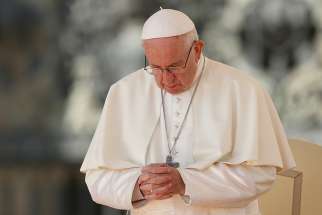 Pope Francis prays during his general audience in St. Peter&#039;s Square at the Vatican Oct. 10. 
