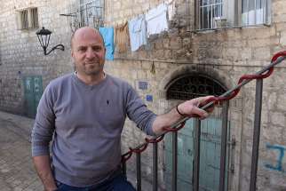 Palestinian Christian Sami Awad, founder and executive director of the Holy Land Trust, poses outside his office Feb. 27 in Bethlehem.