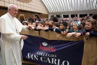 Pope Francis greets students from Milan&#039;s Istituto San Carlo during an audience at the Vatican April 6, 2019.