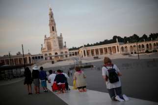 Pilgrims walk on their knees May 8 at the Marian shrine of Fatima in central Portugal. Pope Francis will declare the sainthood of Blessed Jacinta Marto and Blessed Francisco Marto, two of the shepherd children who saw Mary, during his visit to Fatima May 13.