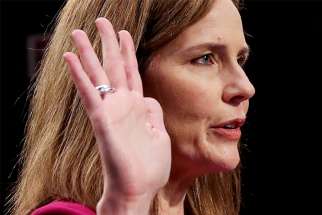 Judge Amy Coney Barrett of the U.S. Court of Appeals for the 7th Circuit, President Donald Trump&#039;s nominee for the U.S. Supreme Court, is sworn in during a confirmation hearing before the Senate Judiciary Committee on Capitol Hill in Washington Oct. 12, 2020.