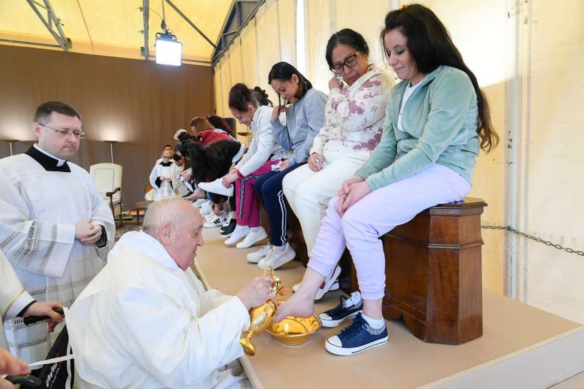Pope Francis washes the feet of an inmate at the Rebibbia women&#039;s prison on the outskirts of Rome as he celebrates the Holy Thursday Mass of the Lord&#039;s Supper March 28, 2024. The pontiff washed the feet of 12 inmates at the prison.