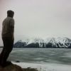 Nathan Michaluk looks out at Atlin Lake during a 10-day mission tour of the Yukon. Eight young Catholics went on the trip at the invitation of Whitehorse Bishop Gary Gordon.