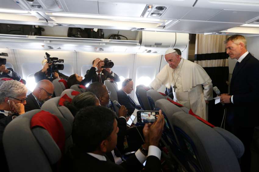 Pope Francis answers questions from journalists aboard his flight from Antananarivo, Madagascar, to Rome Sept. 10, 2019.