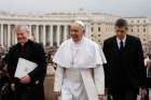 Pope Francis walks next to aides as he arrives to lead his general audience in St. Peter&#039;s Square at the Vatican Feb. 3.