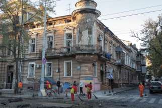 Municipal workers clean an area at the site of a Russian missile strike in Odesa, Ukraine, Nov. 6. Ukraine’s Secret Service announced suspicion against Russian Orthodox Patriarch Kirill of Moscow, who, it said, “blessed the racists to kill Ukrainians.” 