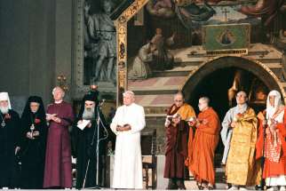 Pope John Paul II attends an inter-religious peace meeting in Assisi, Italy, in this Oct. 27, 1986, file photo. Religious leaders are celebrating the event&#039;s 30th annivesary Sept. 18-20