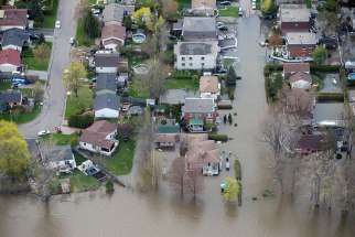 An overhead view taken May 8 shows the flooded residential neighborhood in Ile Bizard, Quebec. A mix of heavy rains and melting snow caused the situation.