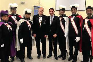 MP Peter Fonseca, fourth from right, with a Knights of Columbus honour guard at the Mass for the relic of St. Francis Xavier at the Mississauga parish named after the saint. 