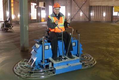 Fr. Larry Pederson monitors construction of the new St. Francis Xavier Church in Camrose, Alta. 
