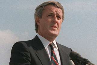 Prime Minister Brian Mulroney bids farewell to dignitaries after an official visit to Andrews Airforce Base, Maryland, USA, in 1984.
