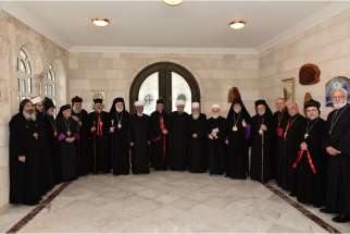 Catholic, Orthodox and Muslim religious leaders meet for an interfaith summit in Bkerke, Lebanon, March 30. They affirmed the &quot;essential role&quot; of the Christian presence in the Middle East and called for terrorism in the region to be confronted culturally , educationally and politically.