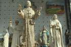 Statues of Pope Francis and his namesake, St. Francis, fill the windows of souvenir stores in Assisi.