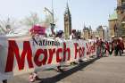 Pro-life supporters carry a banner during the annual National March for Life on Parliament Hill May 2016 in Ottawa, Ontario. 