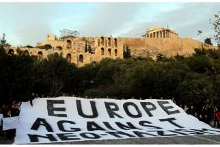 People demonstrate silently in this 2012 file photo of a protest in Athens, Greece, against a rising surge of racism, anti-Semitism and neo-Nazism in Europe.