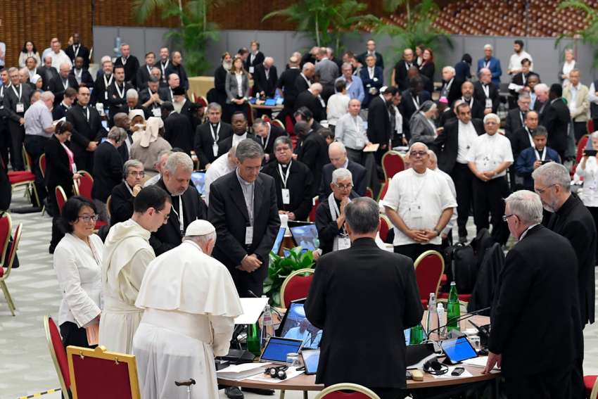 Pope Francis prays with participants in the assembly of the Synod of Bishops before making a rare speech to the gathering Oct. 25, 2023, in the Paul VI Audience Hall at the Vatican.