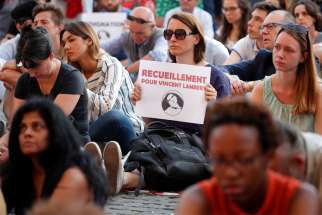 People demonstrate in Paris July 10, 2019, in support of Vincent Lambert, who suffered serious brain damage and had been in a deep vegetative state for more than a decade. &quot;Every life is valuable, always,&quot; Pope Francis tweeted after offering prayers for Lambert, a 42-year-old French man who died July 11, nine days after doctors stopped providing him with nutrition and hydration.