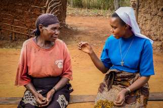 Sister Dativa Mukebita talks with Nikodem Lucian at the Village Angels of Tanzania project in Ngara, Tanzania.