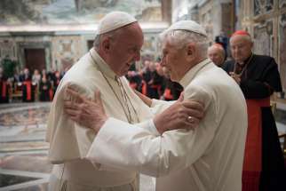 Pope Francis greets retired Pope Benedict XVI during a June 28 ceremony at the Vatican marking the 65th anniversary of the retired pope&#039;s priestly ordination.