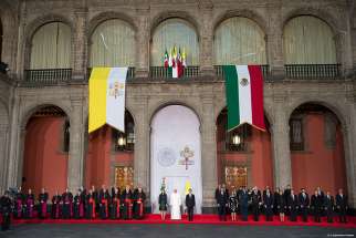 Pope Francis, Mexico&#039;s first lady Angelica Rivera and Mexico&#039;s President Enrique Pena Nieto participate in a ceremony at the National Palace in Mexico City, Mexico Feb. 13