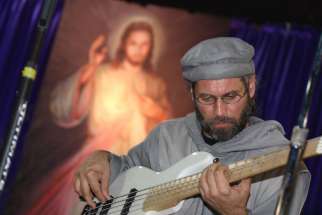 Fr. Stan Fortuna has toured the world, making music and raising funds for the poor.