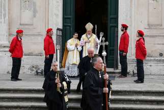 Members of the Knights of Malta and the prelate of the order, Bishop Jean Laffitte, walk in procession at the start of voting for a new leader in Rome May 2. The Knights elected Fra&#039; Giacomo Dalla Torre as their new grand master from among 12 eligible knights to oversee the order for one year. The order&#039;s former grand master resigned amid a conflict with Pope Francis. 