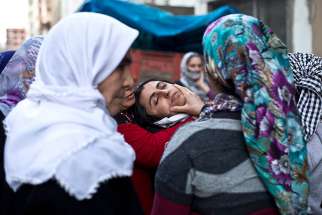 Kurdish women mourn during a funeral ceremony in Sirnak, Turkey, Jan. 10. The U.S. House Foreign Affairs Committee March 2 unanimously passes two bipartisan measures to address war crimes and genocide in Middle East.
