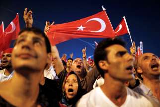 Supporters of Turkish President Tayyip Erdogan celebrate July16 at Taksim Square in Istanbul after a failed coup attempt. Prime Minister Binali Yildirim said more than 200 people were killed during the failed coup attempt.