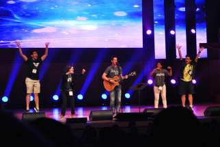 More than 1,600 youth sang and praised God at the Steubenville Toronto conference held at Roy Thomson Hall Aug. 7-9. In this photo, musician Cooper Ray, centre, invited youth on stage to demonstrate dance moves for the crowd to accompany his song.