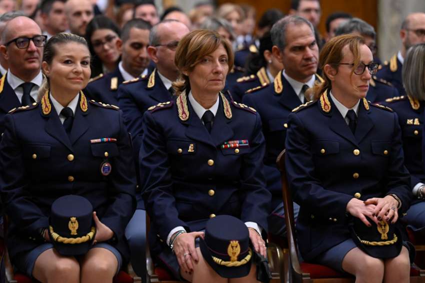 Members of the central anti-crime directorate of the Italian state police listen to Pope Francis during an audience in the Clementine Hall of the Apostolic Palace at the Vatican Nov. 26, 2022. The pope spoke to the officers about the importance of education, prevention and swift justice in fighting violence against women.